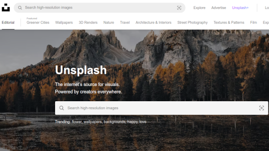 Unsplash home page showing mountain and river 